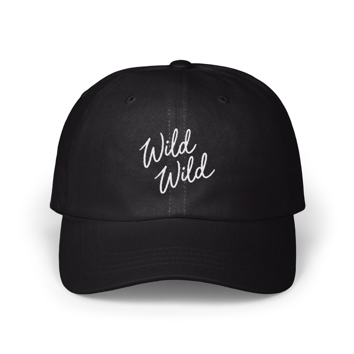 A black baseball cap features the white embroidered cursive text Wild Wild on the front.