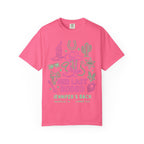 Pink t-shirt with "Her Last Rodeo" graphic in green, cowboy boots, sheriff star, and cactus.