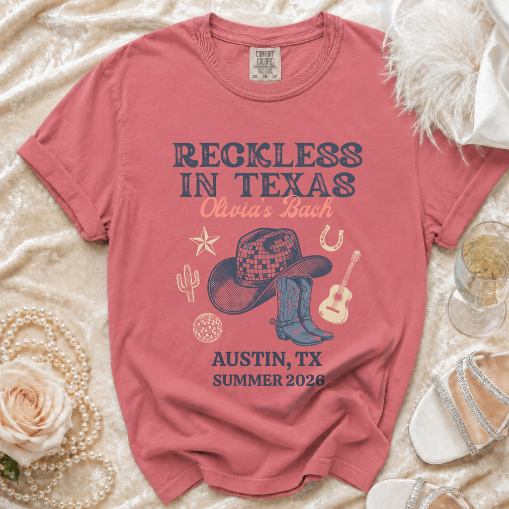 T-shirt with "Reckless in Texas Olivia's Bach Austin, TX Summer 2026" text.