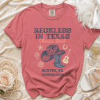 T-shirt with "Reckless in Texas Olivia's Bach Austin, TX Summer 2026" text.