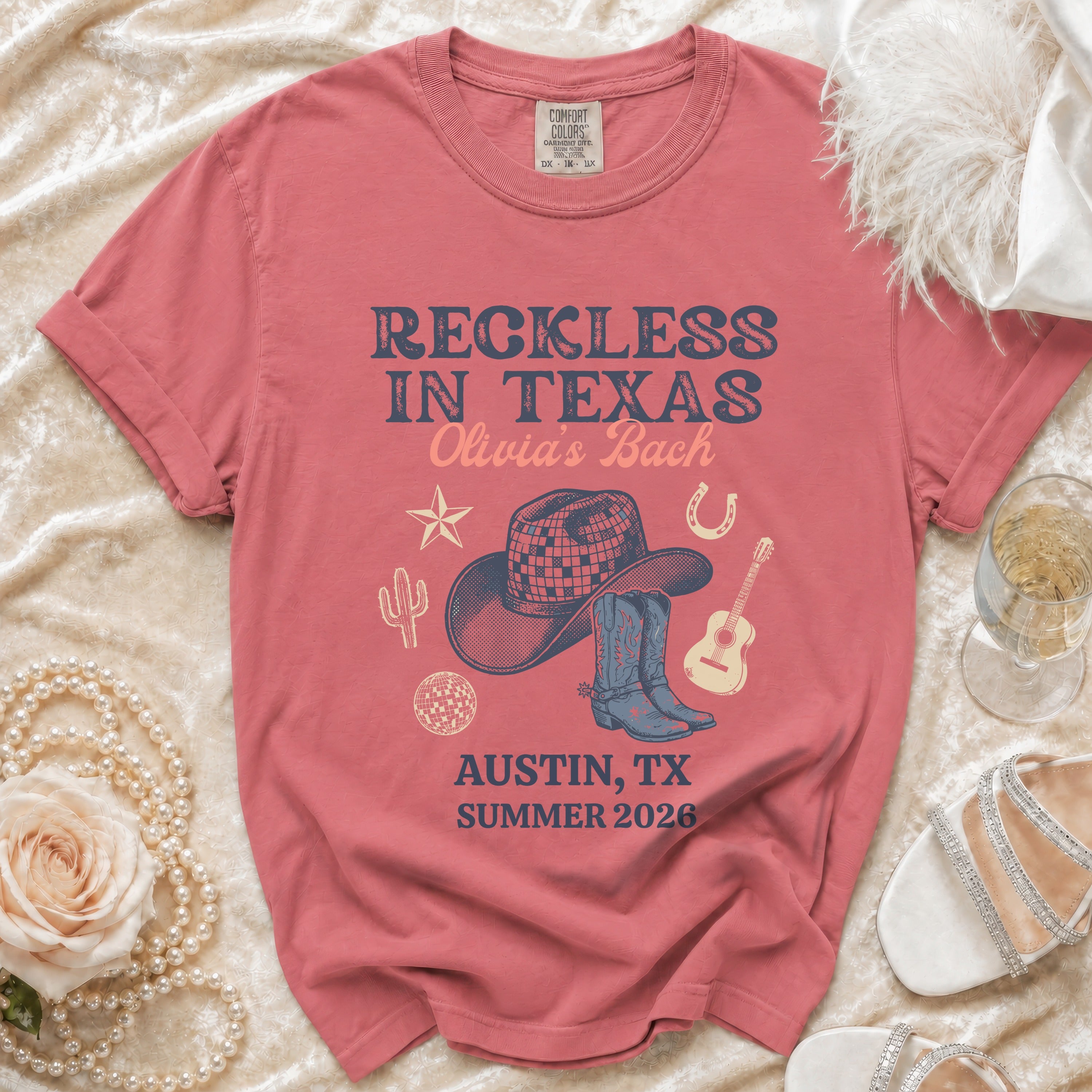 T-shirt with "Reckless in Texas Olivia's Bach Austin, TX Summer 2026" text.