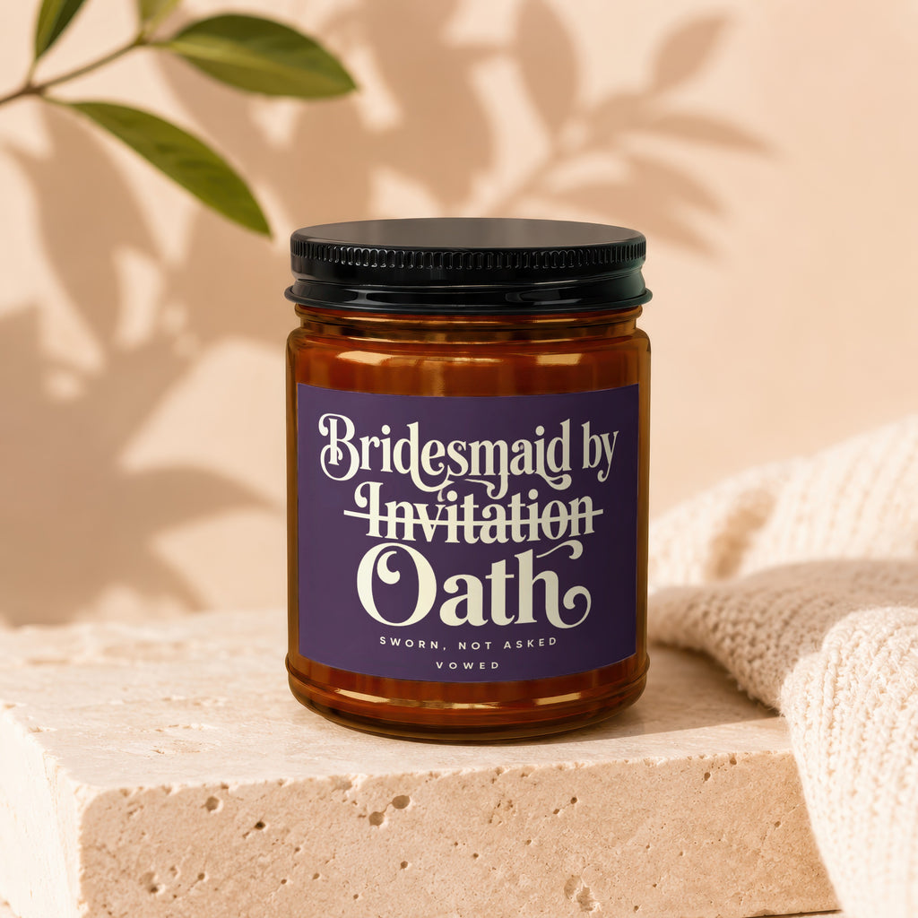 Candle with label reading "Bridesmaid by Invitation Oath".