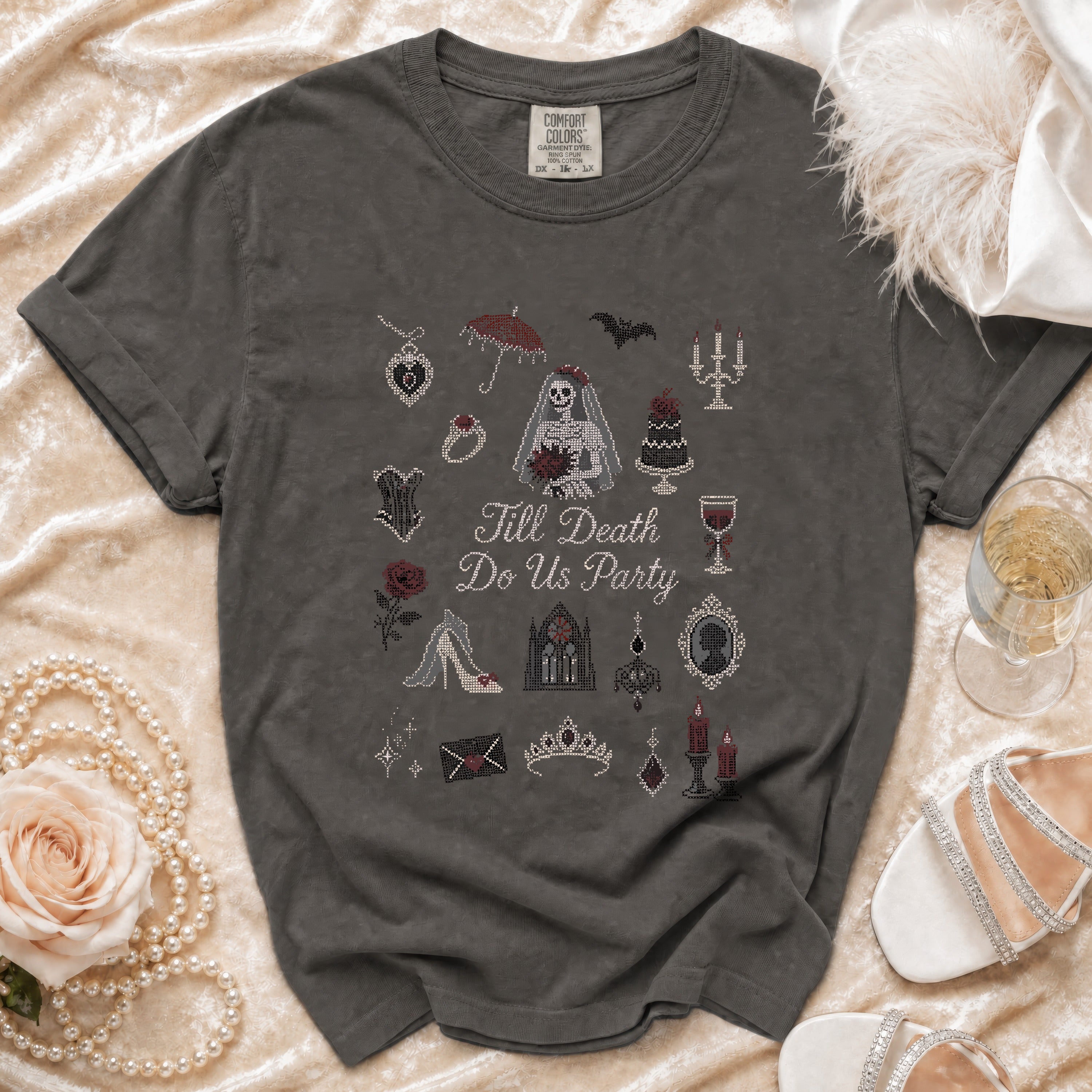 T-shirt with "Till Death Do Us Party" text and gothic wedding-themed cross-stitch designs.