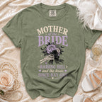 Green t-shirt with "Mother of the Bride Raising Hell" design and skeleton hands holding flowers.