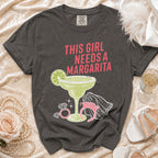 Dark grey t-shirt with "This Girl Needs a Margarita" design and margarita glass graphic.