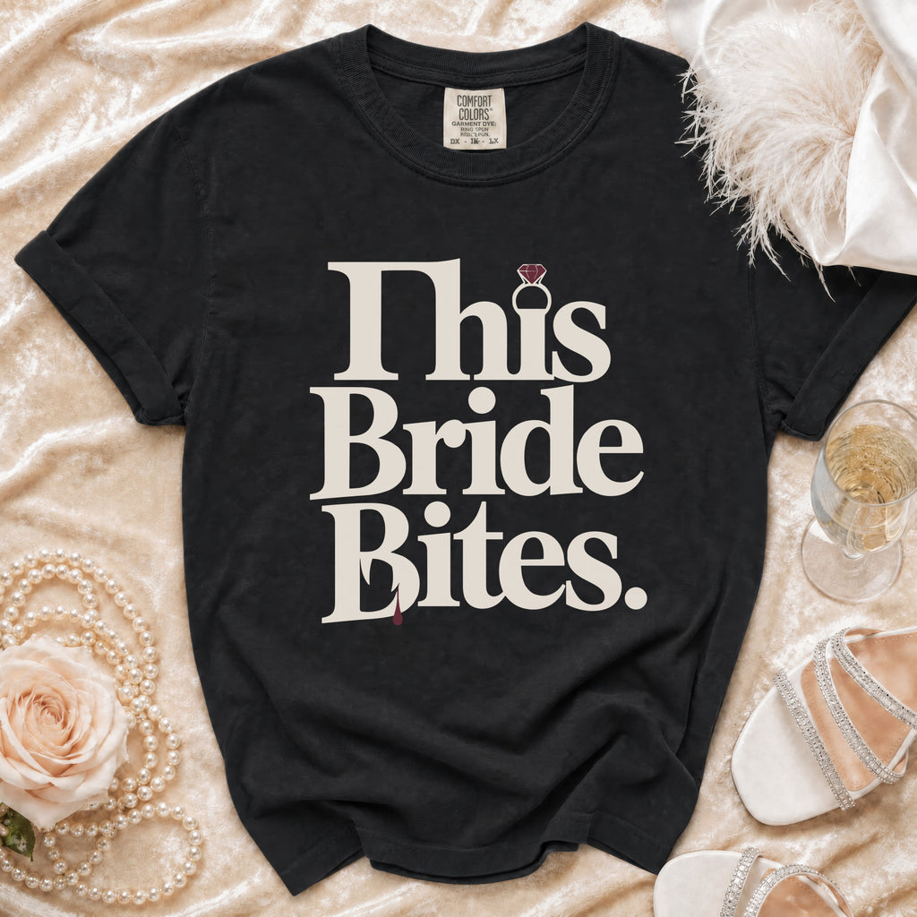 Black t-shirt with "This Bride Bites" text and a diamond ring graphic.
