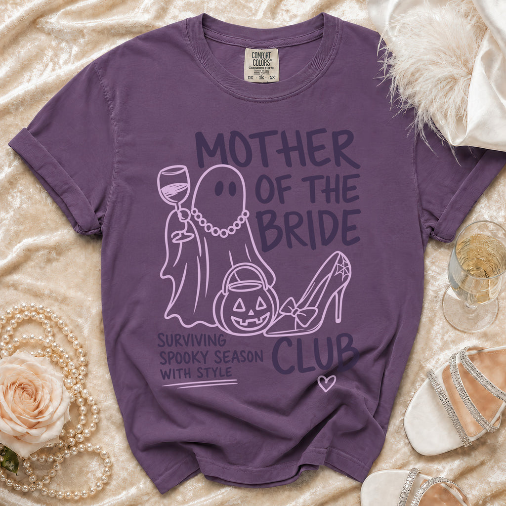 Purple t-shirt with "Mother of the Bride" text, ghost, pumpkin, and high heel graphic.