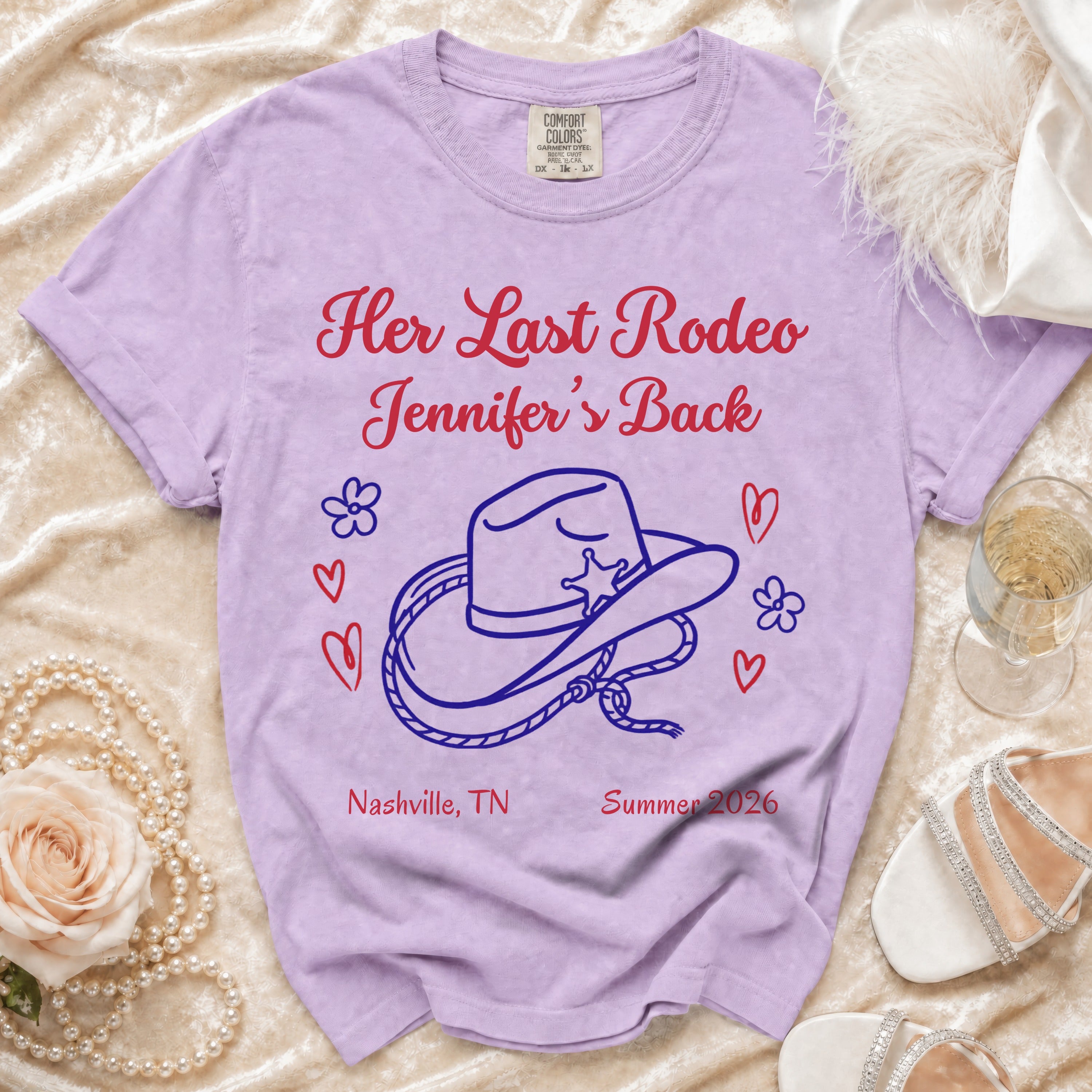 Purple t-shirt with "Her Last Rodeo Jennifer's Back" text, hat graphic, hearts, and Nashville 2026.