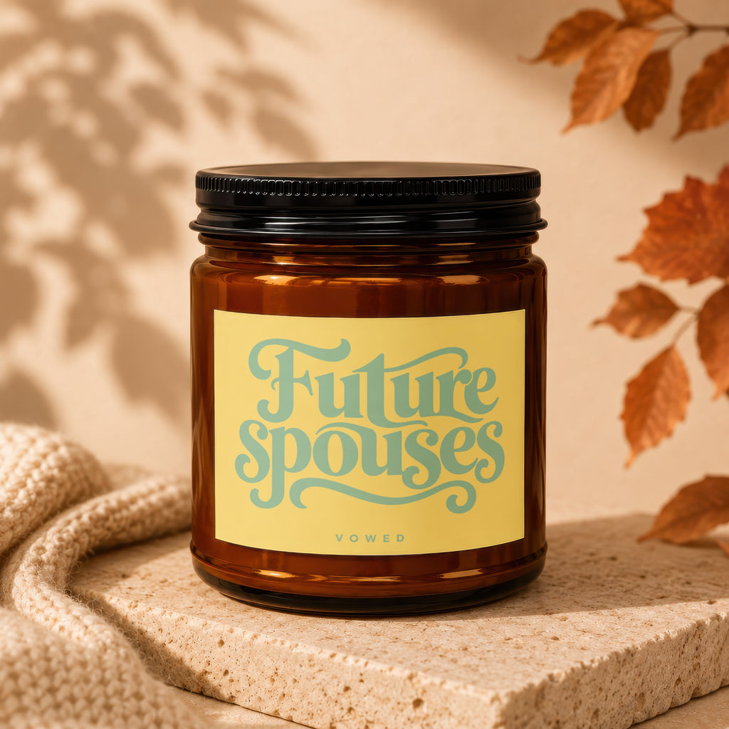 Amber glass candle with "Future spouses" text on a yellow label.