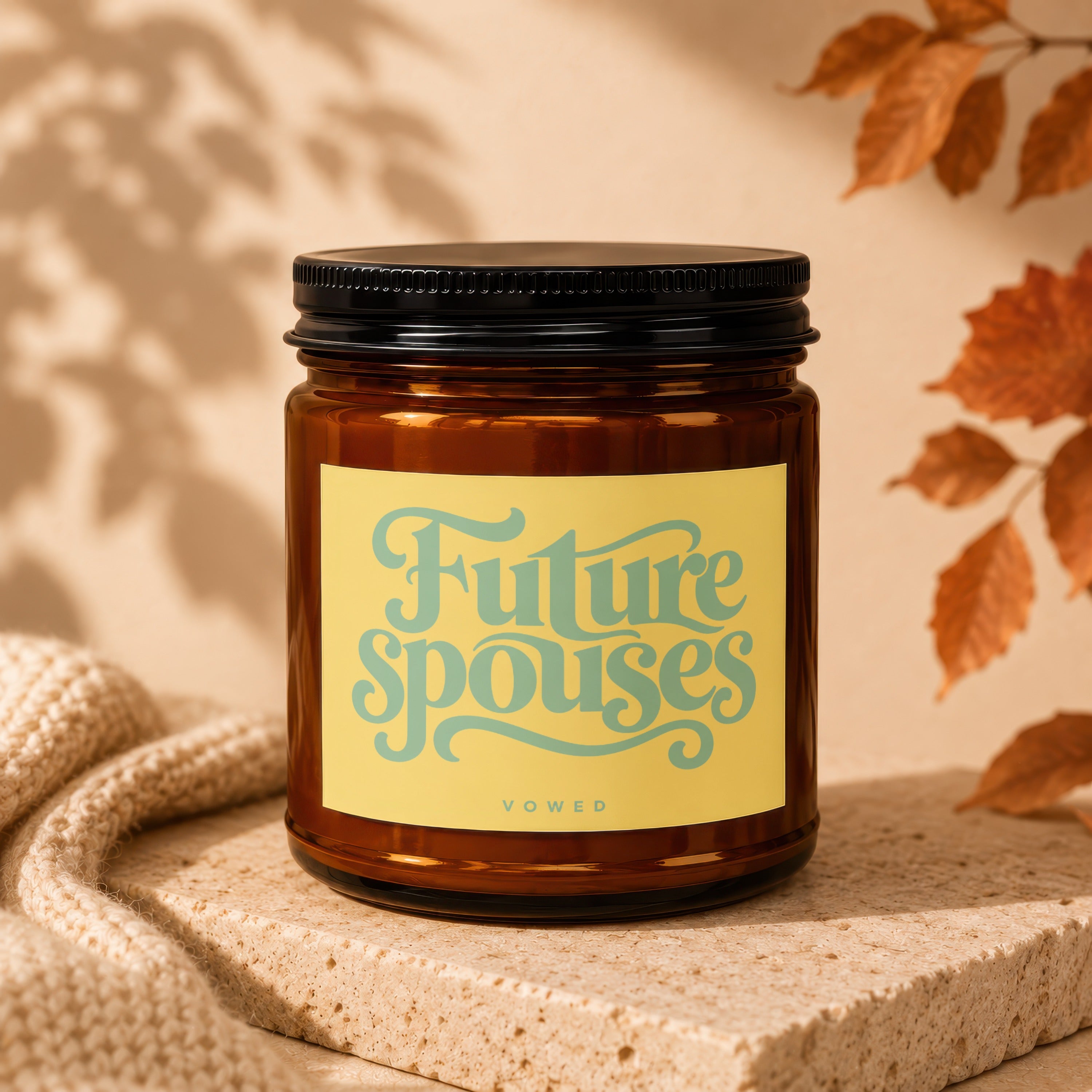 Amber glass candle with "Future spouses" text on a yellow label.