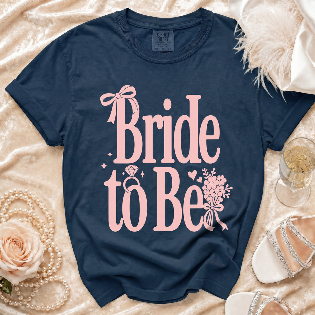 Navy t-shirt with pink "Bride to Be" text, ring, and floral design.