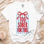 White t-shirt with "TOO SOBER FOR THIS" text on blue stripes.