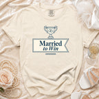 Cream t-shirt with navy graphic "Married to Win" and trophy.
