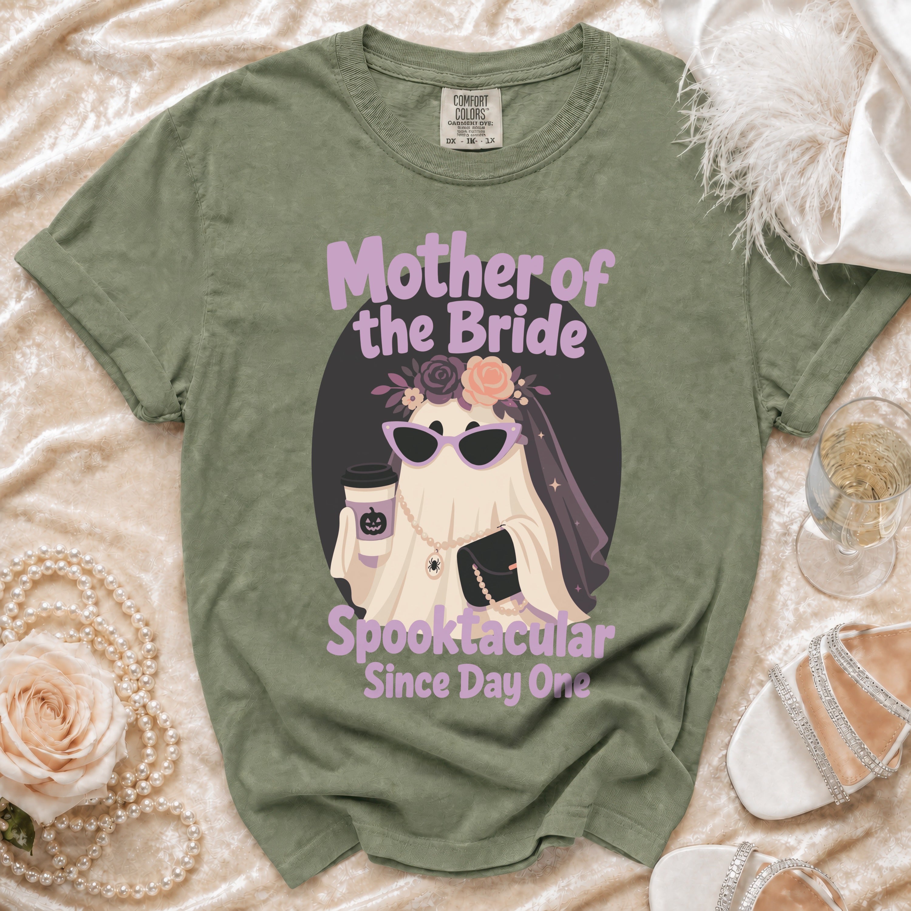 Green t-shirt with "Mother of the Bride Spooktacular Since Day One" text and ghost graphic.