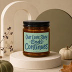 Amber candle in jar with black lid, featuring "Our Love Story Ends Continues" text.