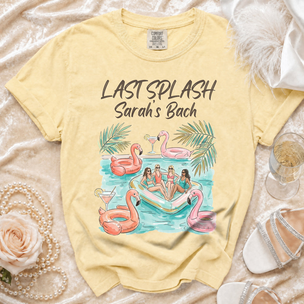 Yellow t-shirt with "Last Splash Sarah's Bach" text and illustration of people on an inflatable flamingo.