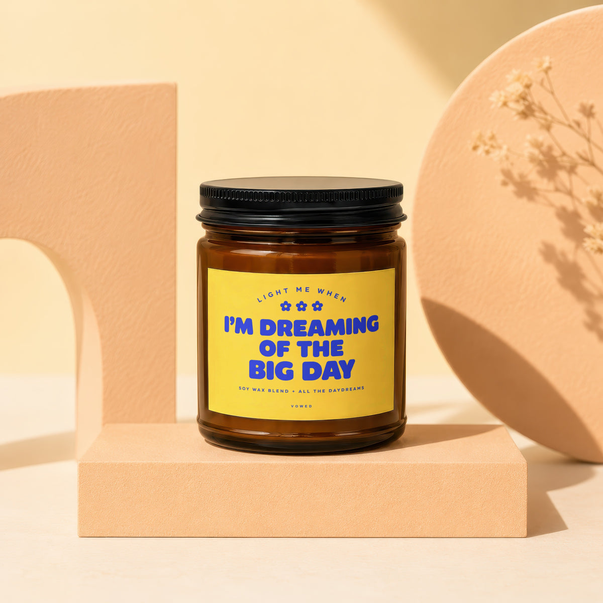 Brown soy wax candle with yellow label reading "I'm Dreaming of the Big Day".