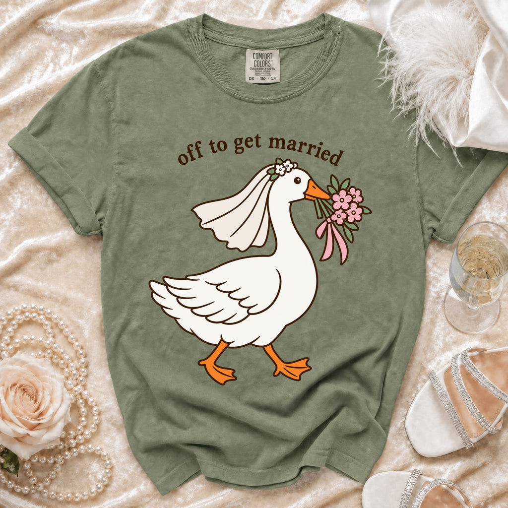 Green t-shirt with graphic of goose in wedding veil and text "off to get married".