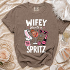 "Wifey Wants a Spritz" graphic t-shirt with bride, drink, and prosecco icons.