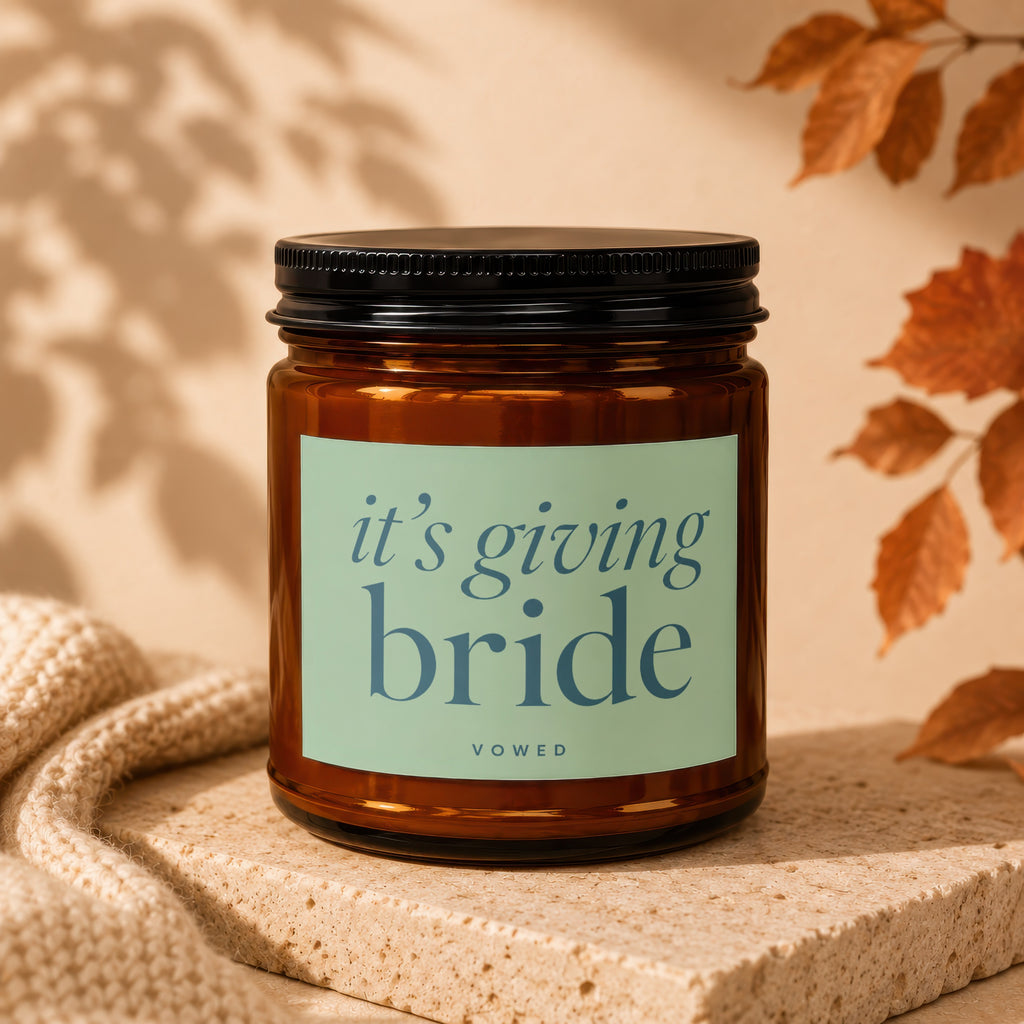Amber jar candle with "it's giving bride" text, VOWED logo.