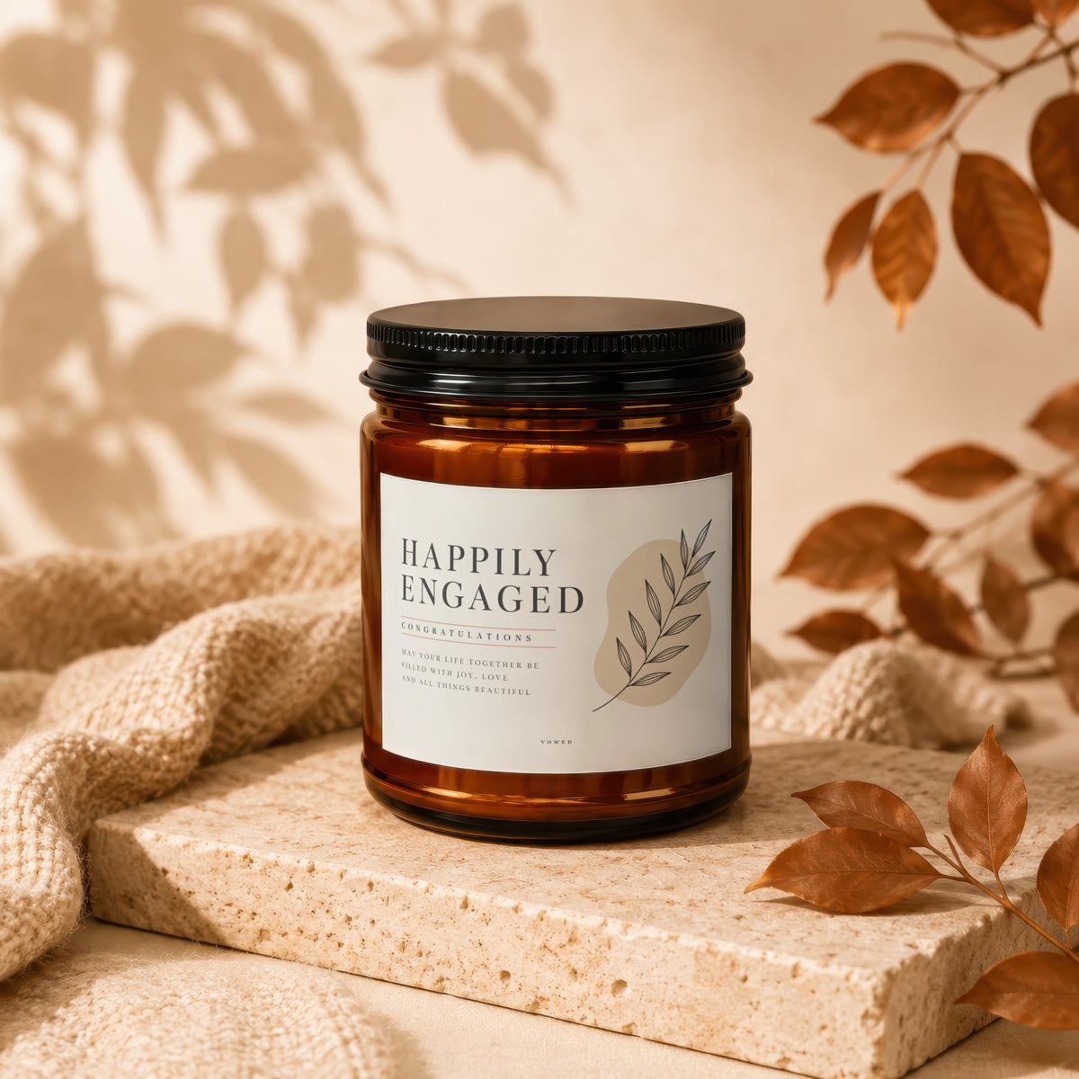 Amber candle labeled "Happily Engaged" with text "Congratulations" and inspirational message.