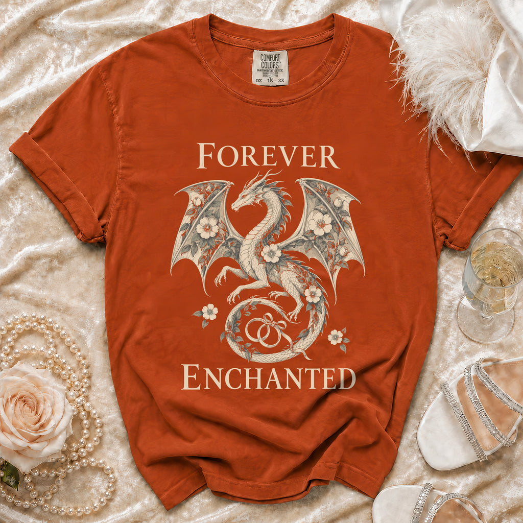 Orange t-shirt with dragon and floral design reading "Forever Enchanted."