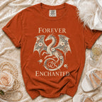 Orange t-shirt with dragon and floral design reading "Forever Enchanted."
