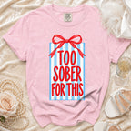 Pink t-shirt with a gift box graphic that reads "TOO SOBER FOR THIS."