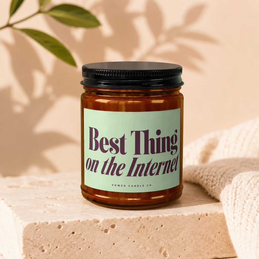 Amber candle with label reading "Best Thing on the Internet" from Vowed Candle Co.