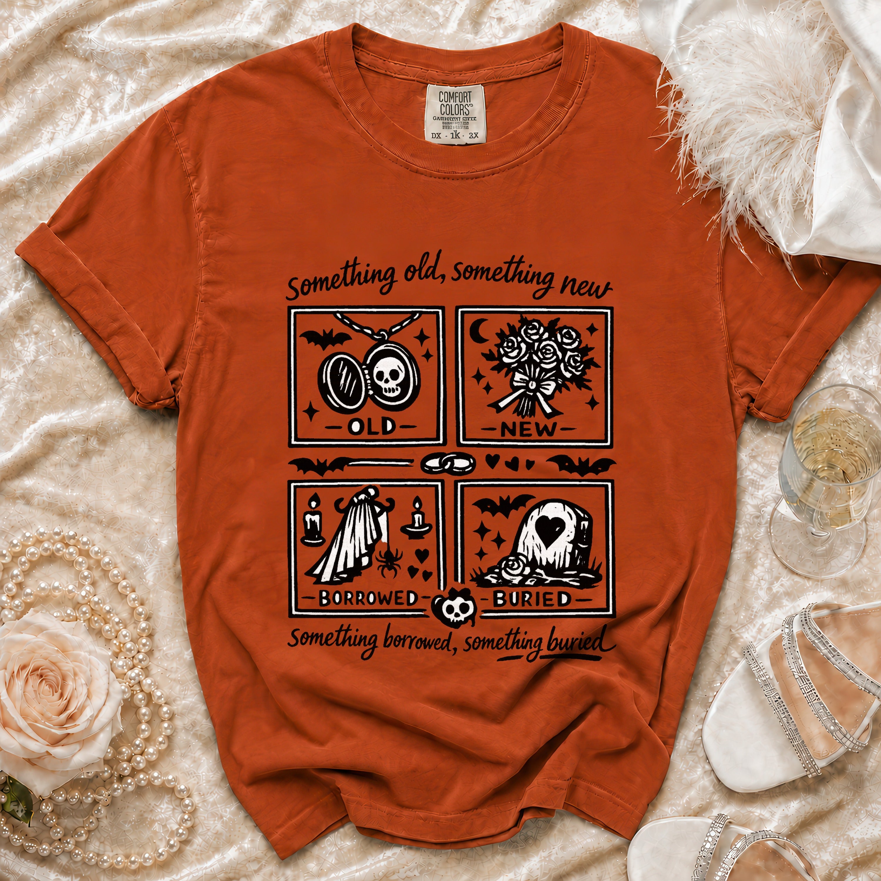 Orange t-shirt with "Something old, new, borrowed, buried" graphic.