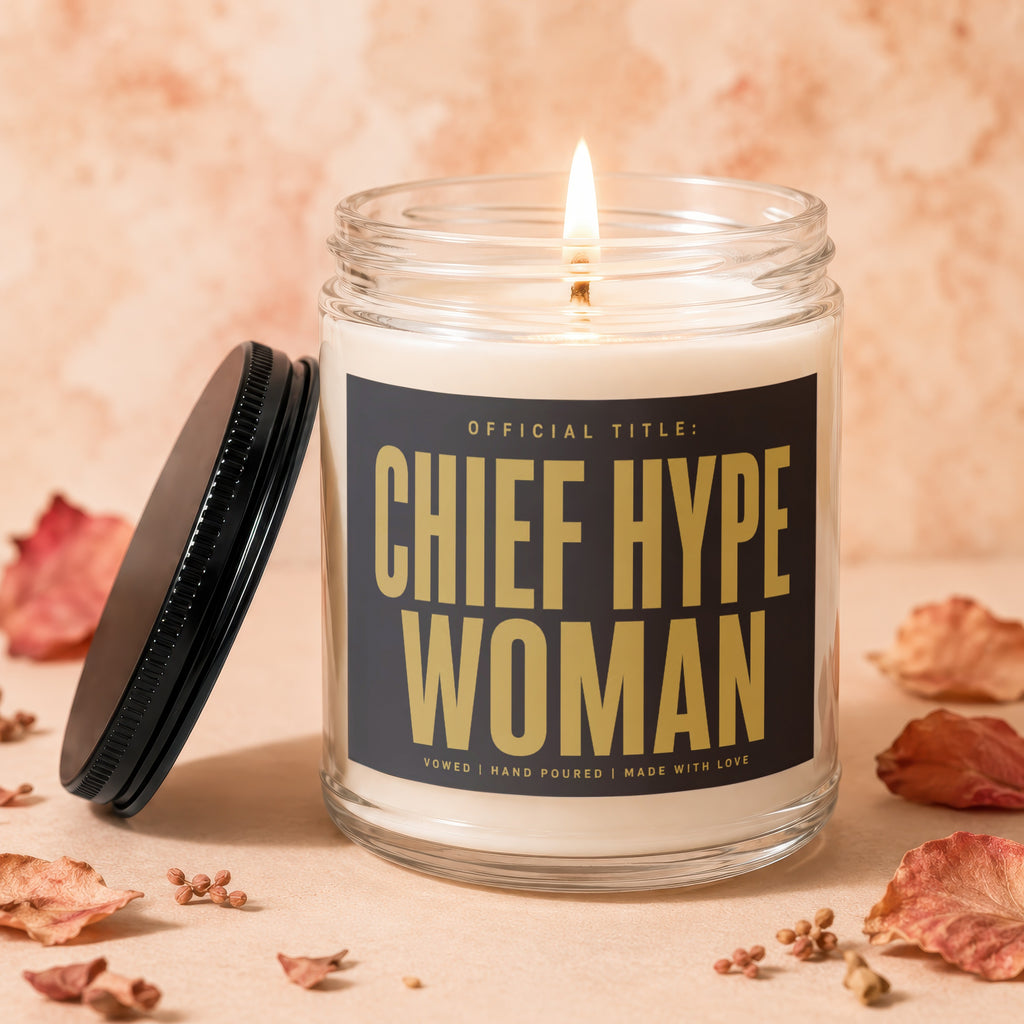 Jar candle with lit wick and lid beside it, reads "Chief Hype Woman".