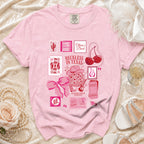 Pink t-shirt with "Reckless in Texas" and disco cowgirl graphics.