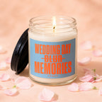 Candle with lit wick, lid off, label reads "Wedding Day Blur Memories Vowed".