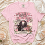 Pink t-shirt with "Mother of the Groom" graphic and humorous text.