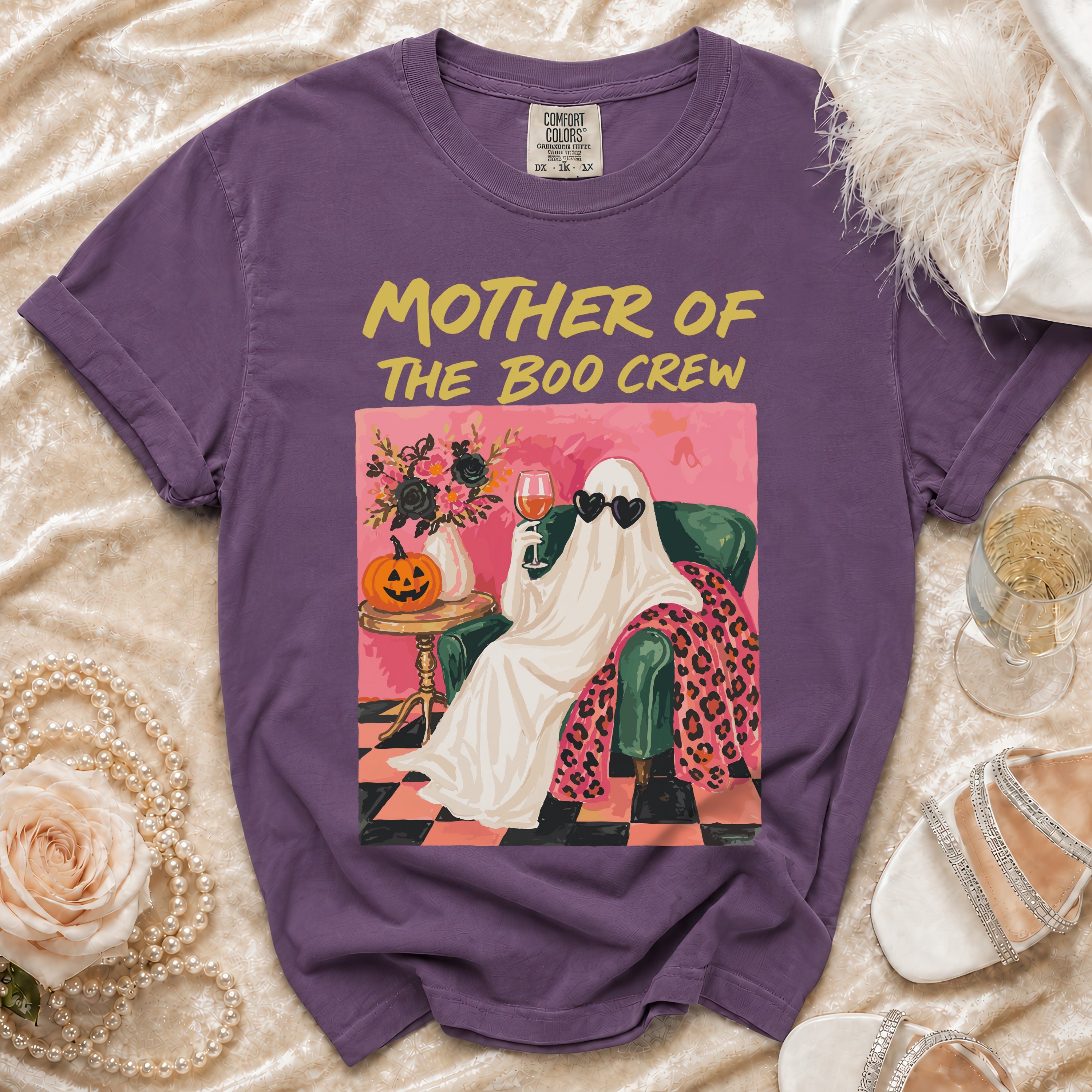 Purple t-shirt with "Mother of the Boo Crew" text and a ghost graphic.