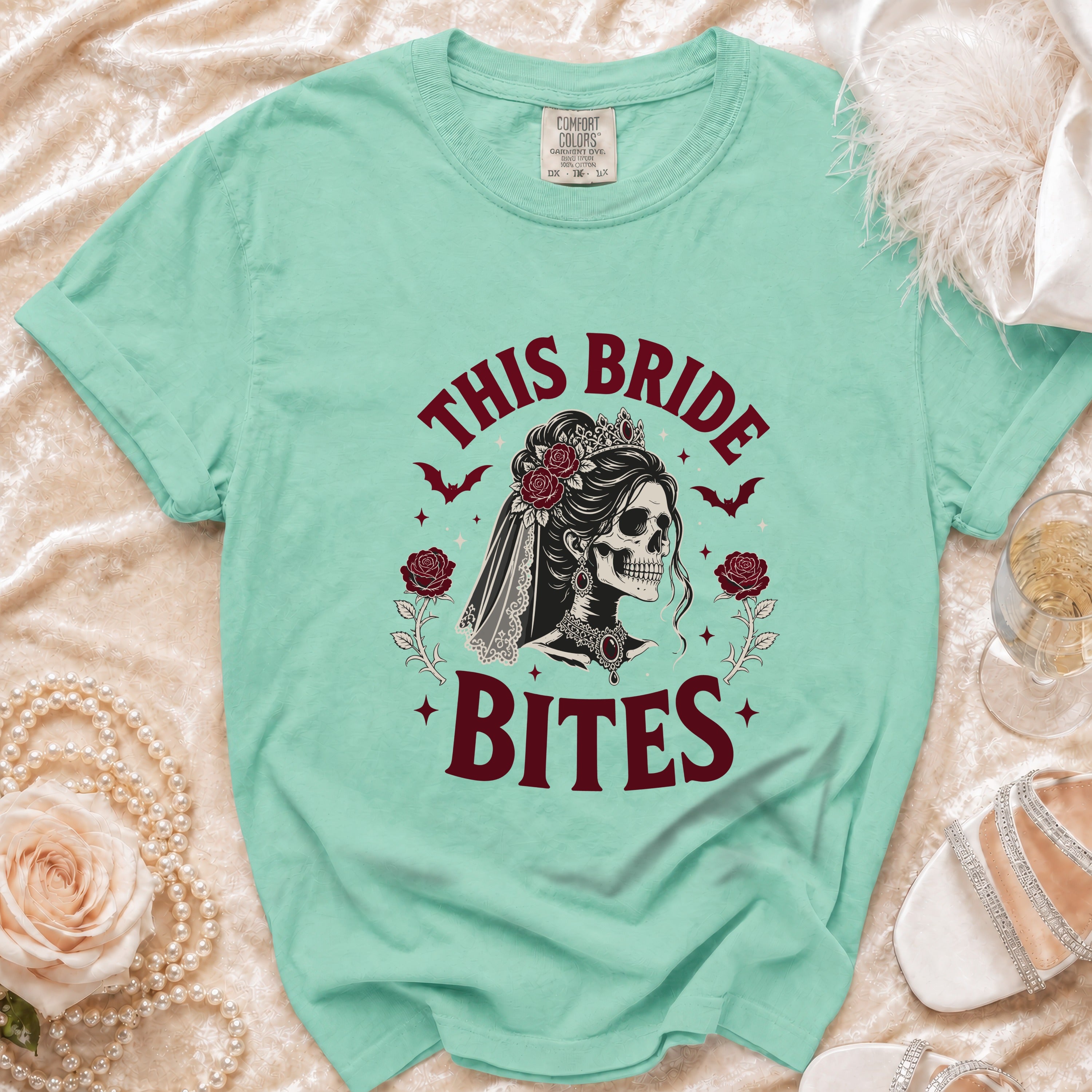Mint t-shirt with skull bride graphic and text "THIS BRIDE BITES".