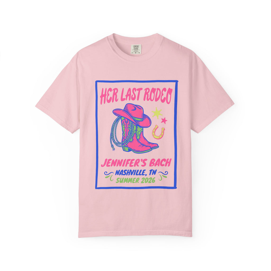 Pink t-shirt with "Her Last Rodeo" design, cowboy boots, and horseshoe.