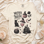 Cream t-shirt with "Mother of the Bride (and still keeping it spooky)" Halloween graphic.