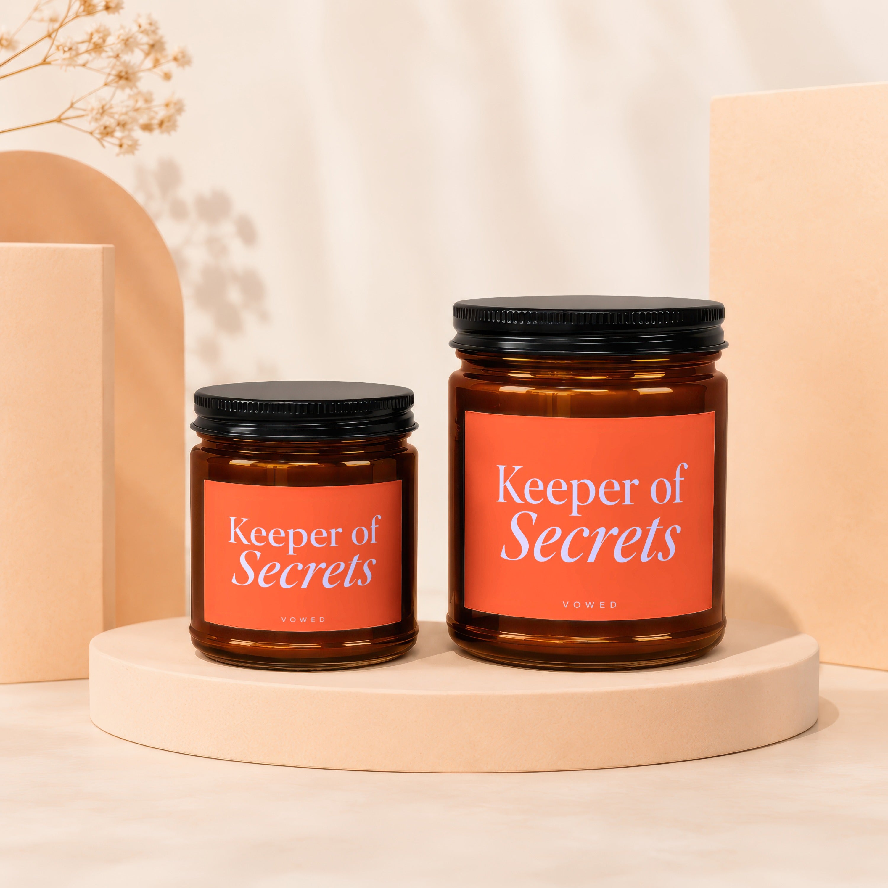 Two glass jars labeled "Keeper of Secrets" in different sizes.