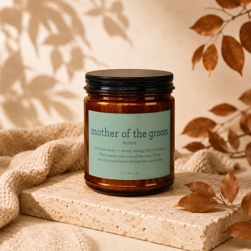 Brown glass candle with "mother of the groom" definition label.