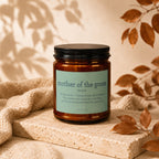 Brown glass candle with "mother of the groom" definition label.