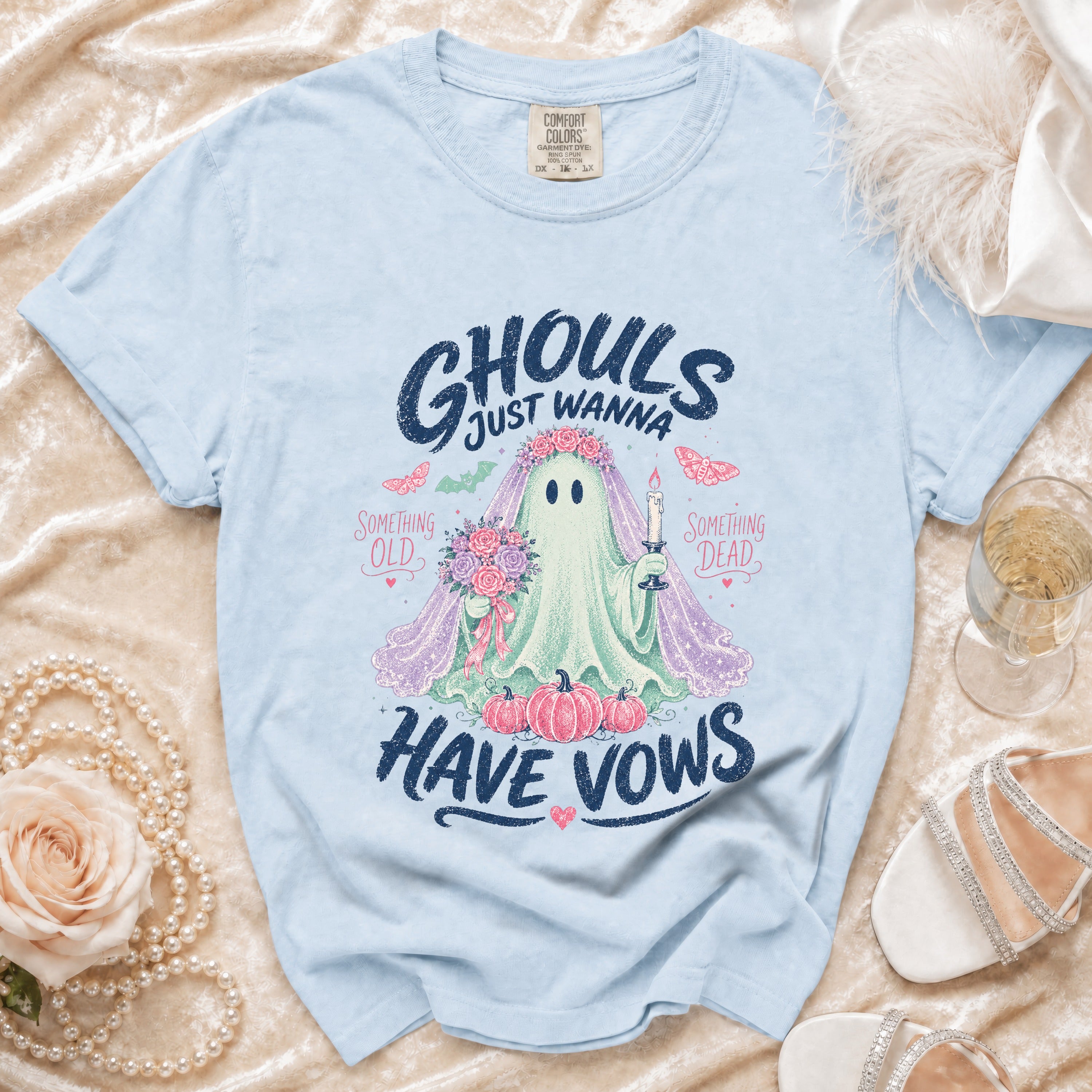 Light blue t-shirt with "GHOULS JUST WANNA HAVE VOWS" graphic.