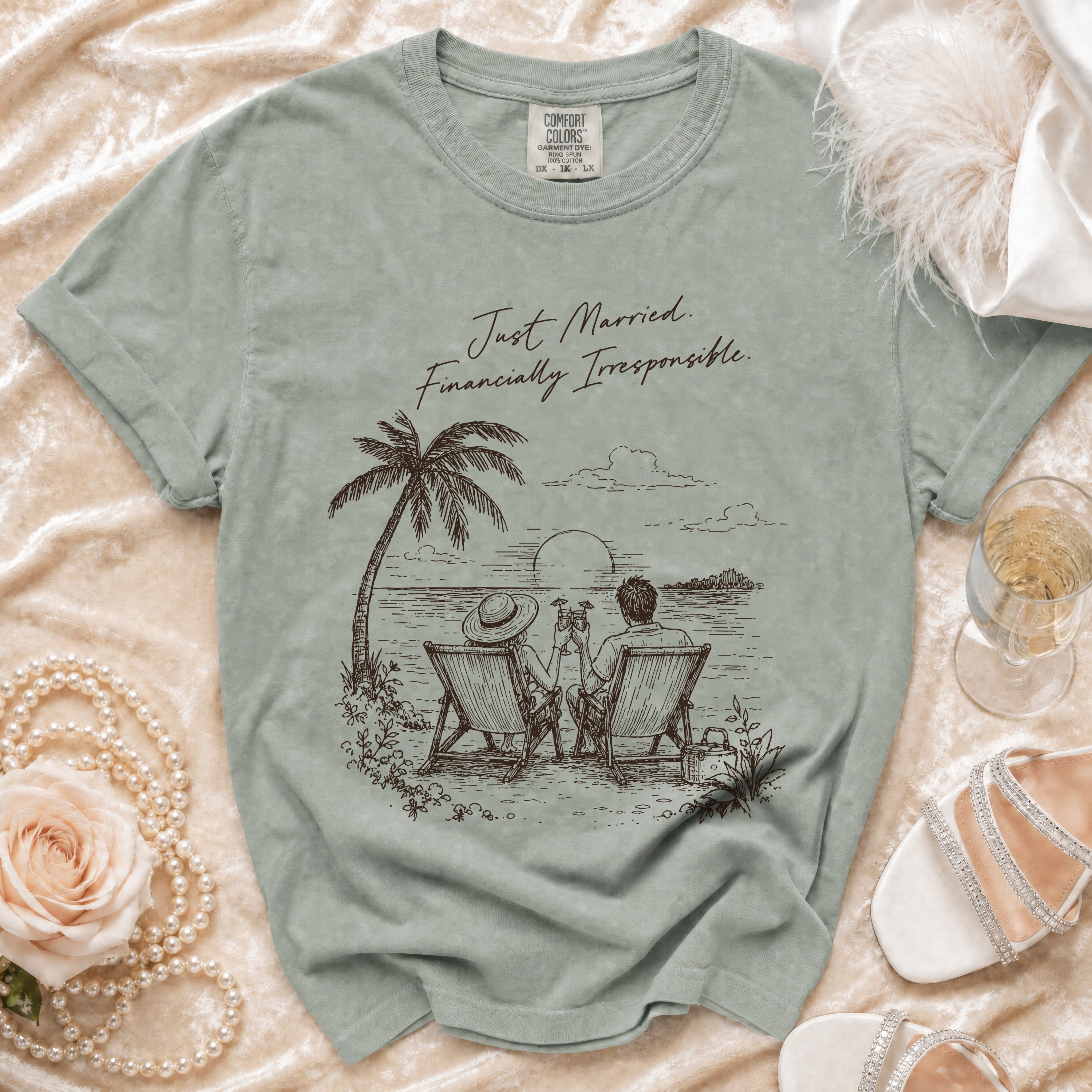 T-shirt with beach graphic and "Just Married. Financially Irresponsible." text.