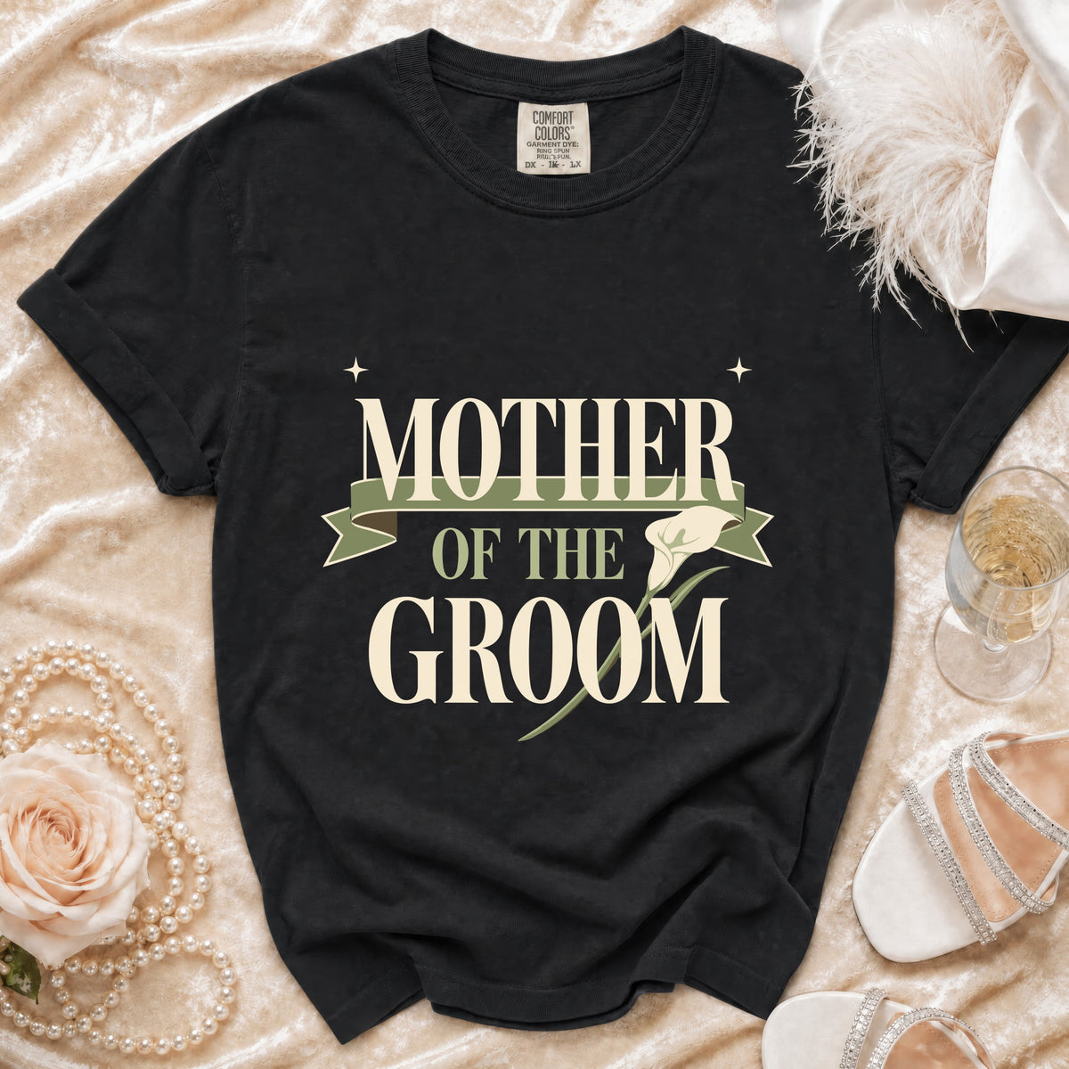 Black t-shirt with "MOTHER OF THE GROOM" text and a calla lily design.