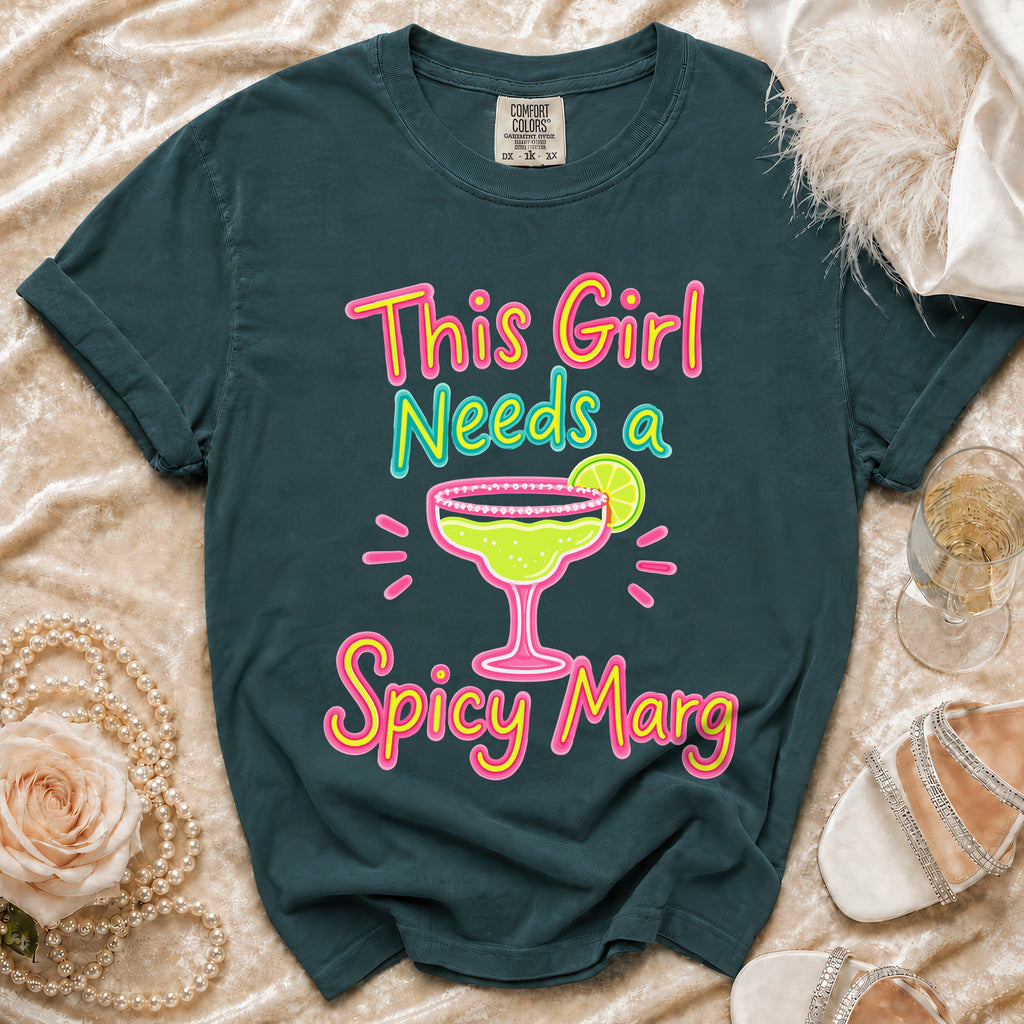 Teal t-shirt with "This Girl Needs a Spicy Marg" text and margarita graphic.