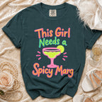 Teal t-shirt with "This Girl Needs a Spicy Marg" text and margarita graphic.