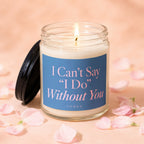 Glass jar candle with lit wick and blue label reading "I Can't Say 'I Do' Without You."