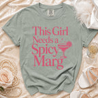 Green t-shirt with "This Girl Needs a Spicy Marg" text and margarita graphic.
