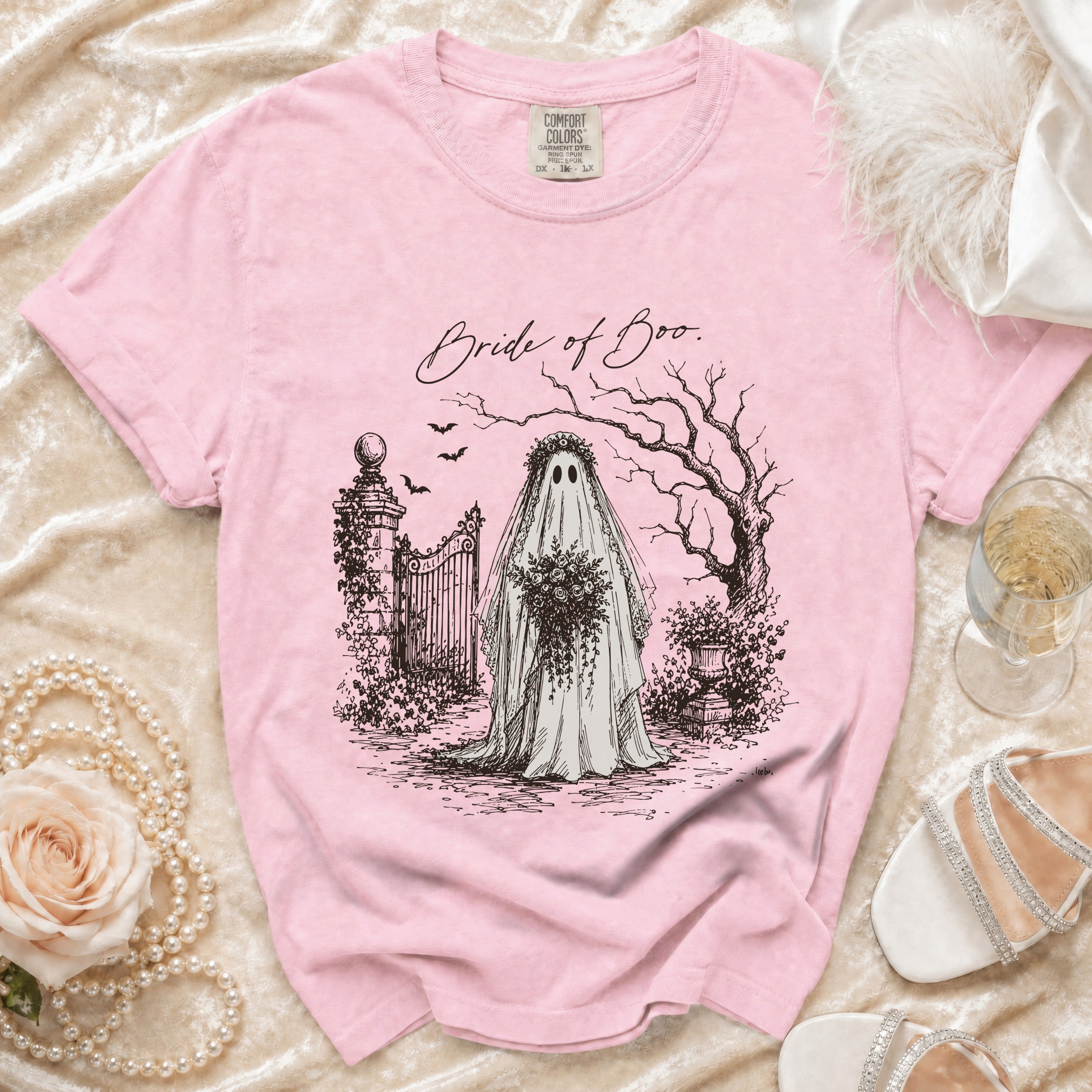 Pink t-shirt with "Bride of Boo" ghost bride graphic, a gate, and bats.