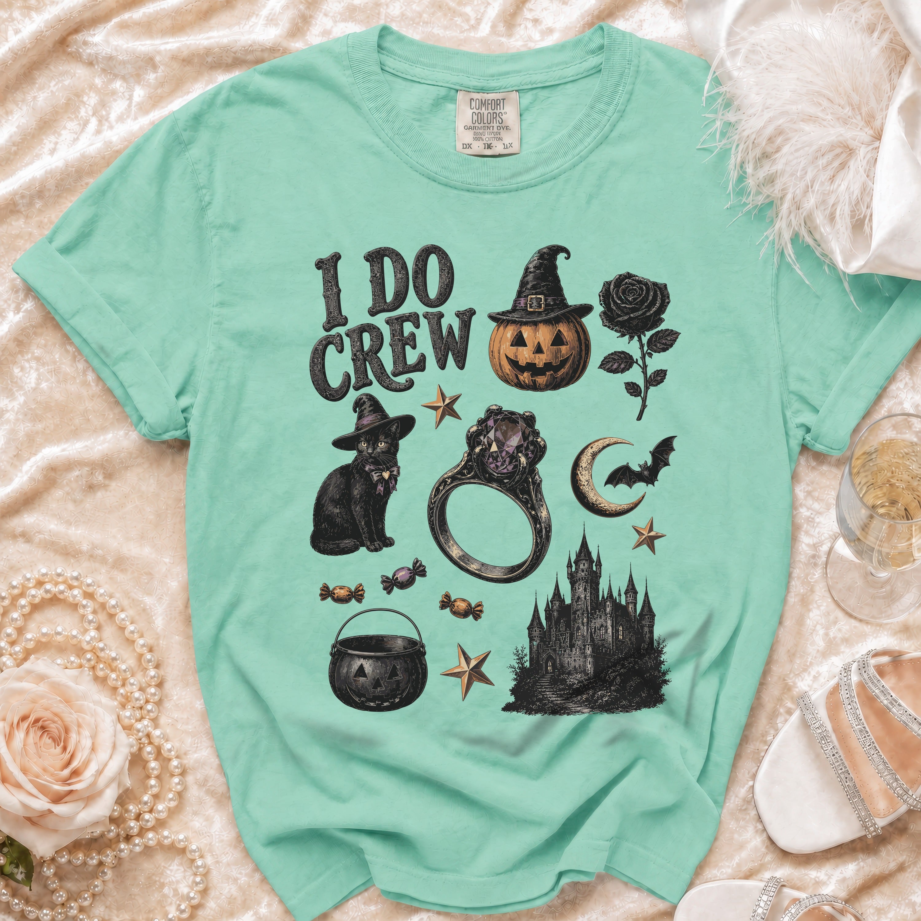 Mint green t-shirt with "I DO CREW" and Halloween-themed graphics.
